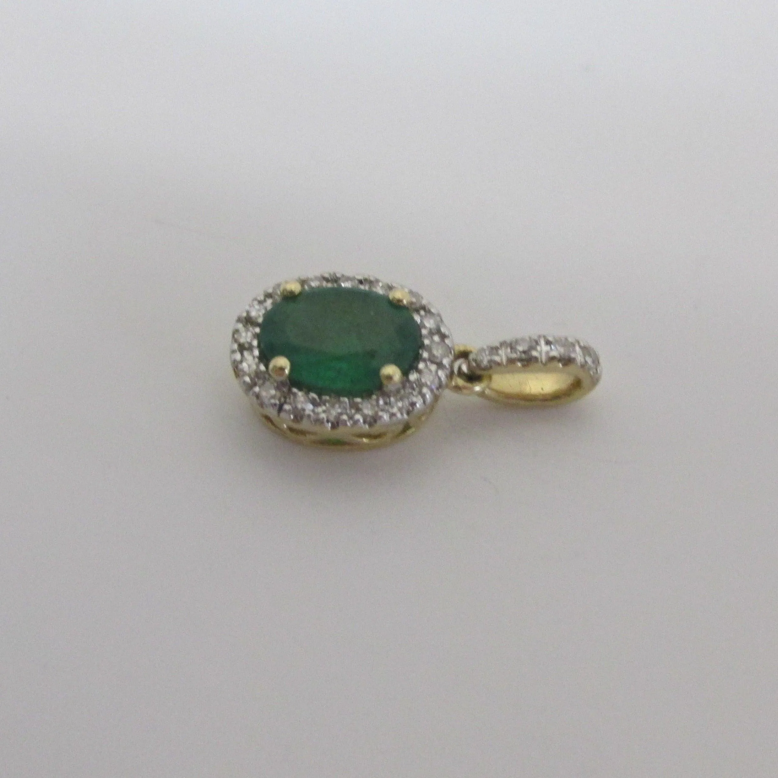 Oval Emerald and Diamond Halo Pendant